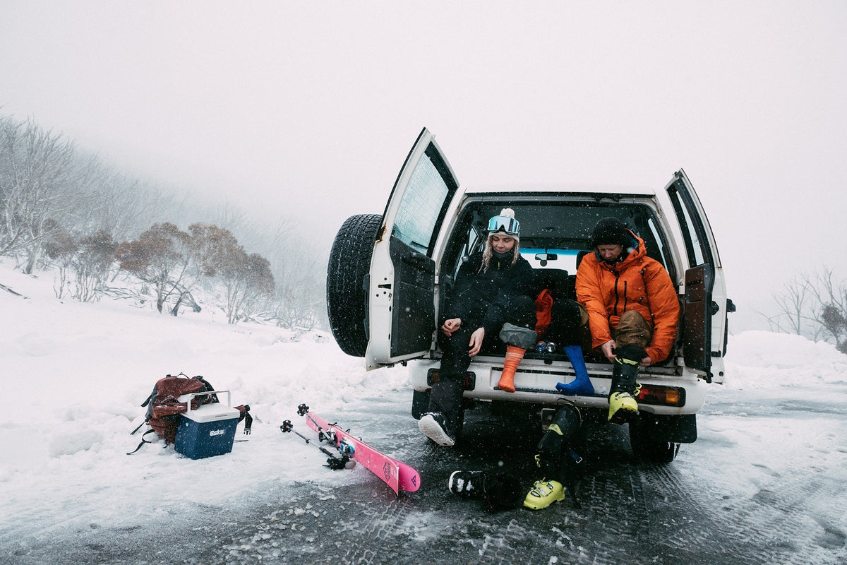Skier pulling on merino ski socks